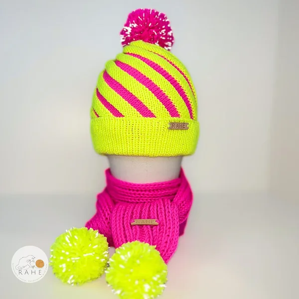 Merino wool kids' reflective hat and scarf set in hot pink and neon yellow. Winter bobble hat for boys and girls with a matching scarf. Handmade in Estonia.