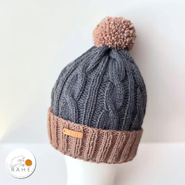 Hand-knitted blue and beige wool winter hat with reflective pom-pom – cozy beanie for kids and teens, handmade in Estonia by RAHEcraft.