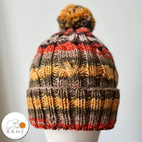 Hand-knitted reflective winter hat with a reflective pom pom for kids, teens, women, and men. Handmade in Estonia. 