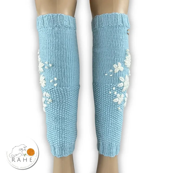 Hand-knitted merino leg warmers with delicate white floral embroidery – light blue, soft and cozy, luxurious Estonian handmade gift for women or teen girls.