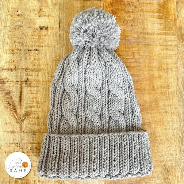 Hand-knitted merino wool kids winter hat in gray. Knitted reflective beanie for teens.
