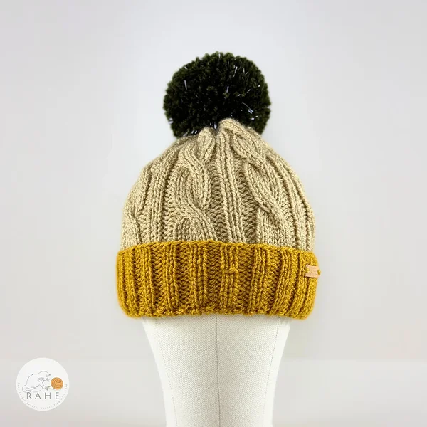 Hand-knitted cable knit winter beanie for boys and girls in yellow, beige, and green. Handmade in Estonia.