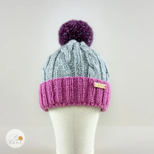 Double brim hand-knitted winter hat with a reflective pom pom for boys and girls, women, and men. Handmade in Estonia.