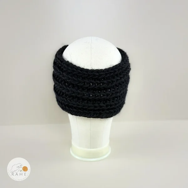 Back view of a hand-knitted black chunky wool ear warmers for girls and women.