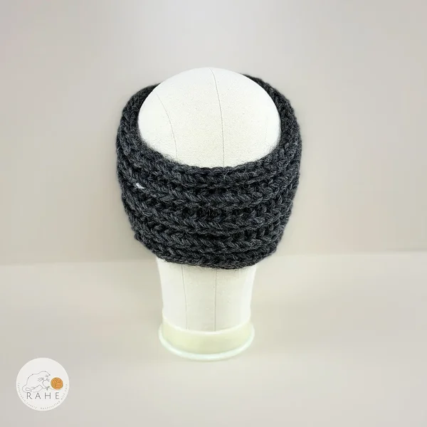 Back view of a hand-knitted charcoal chunky wool ear warmers for girls and women.