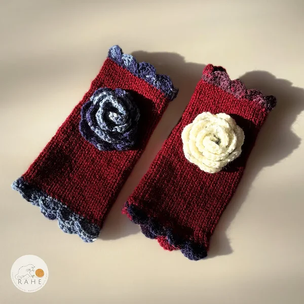 Hand-knitted dark red fingerless gloves with lace edging and crocheted flower – available with different flower colour options.