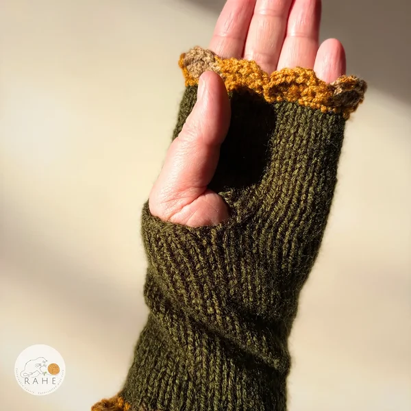 Single RAHEcraft hand-knitted fingerless glove in olive green with mustard yellow and beige lace edging. The soft smooth knit is comfortable and flexible for everyday wear.