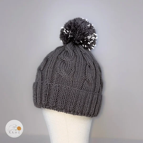 Reflective knitted merino wool hat in grey. Kids pom pom winter beanie.
