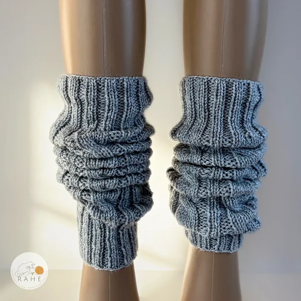 Slouched style RAHEcraft hand-knitted cable knit leg warmers in soft grey yarn. Cozy winter accessory available in Adult, Teen and Kid sizes.