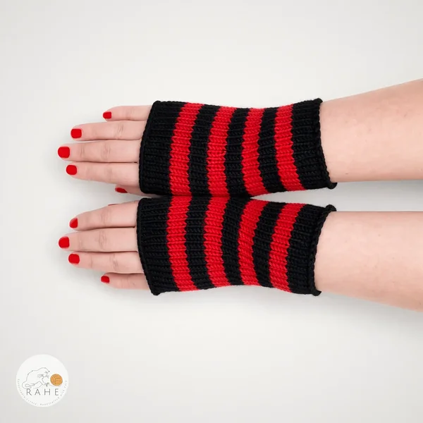 Hand-knitted merino wool arm warmers with black and red stripes, shown on straightened hands. RAHEcraft.