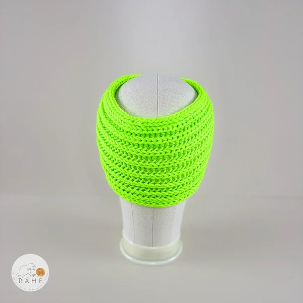 Back view of a hand-knitted bright neon green merino wool ear warmers for girls and women.