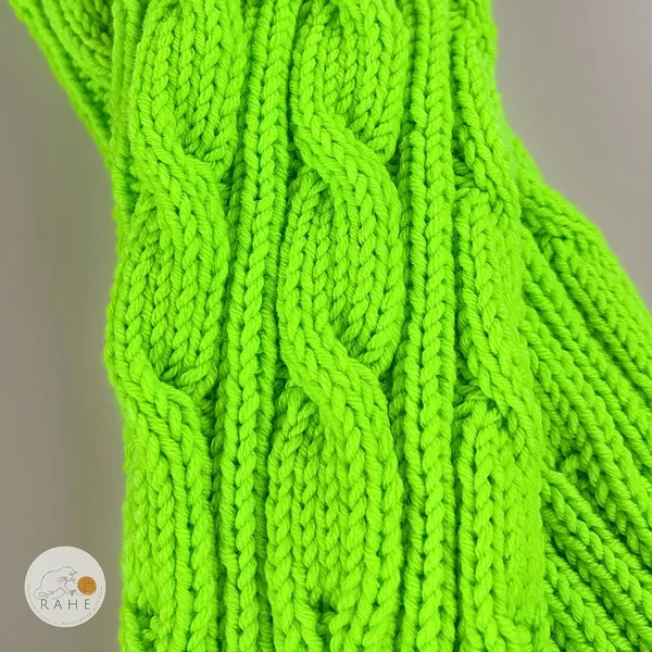 RAHEcraft neon green merino wool leg warmers close up cable knit texture, handmade soft knit detail showing braided cable pattern, high quality cozy knitwear for women teens and kids
