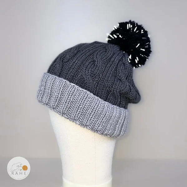 Reflective knitted merino wool hat in light grey, grey, and black. Kids pom pom winter beanie.