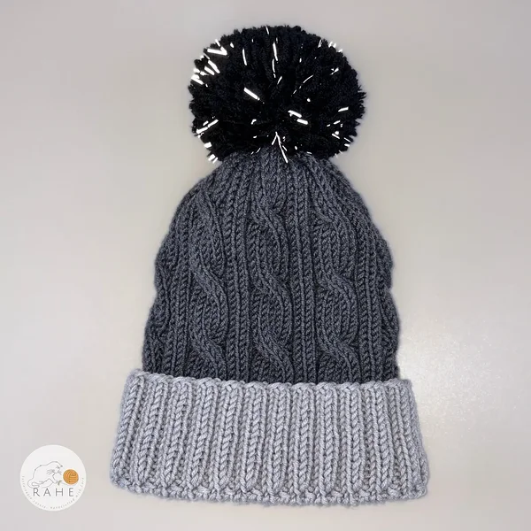Hand-knitted merino wool charcoal cable knit winter hat with a reflective bobble. Unisex winter hat. Estonian handmade gifts.