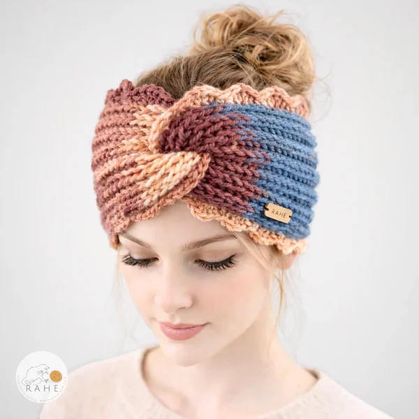 Hand-knitted wide acrylic headband on female model, blue and peach gradient knit headband with twisted front, scalloped lace edge, soft stretchy ribbed texture, RAHEcraft
