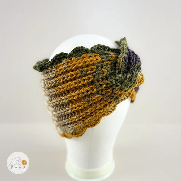 Hand-knitted wide acrylic headband on mannequin head, moss green, purple and mustard yellow gradient headband with twisted detail, fisherman's rib knit texture, crocheted scalloped edge, RAHEcraft