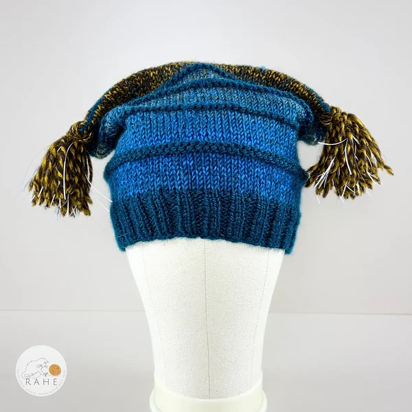 Front view of a hand-knitted wool blend reflective tassel hat designed for kids and adults