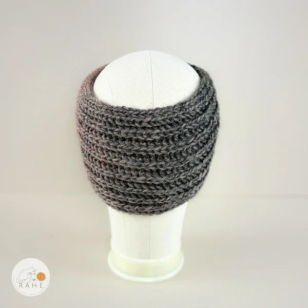 Back view of a hand-knitted  gradient  grey and dusky pink  wool blend ear warmers for girls and women.