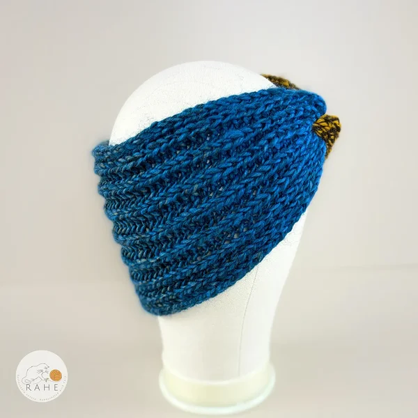 White hand-knitted gradient blue and brown wool blend headband for girls and women. Angled view