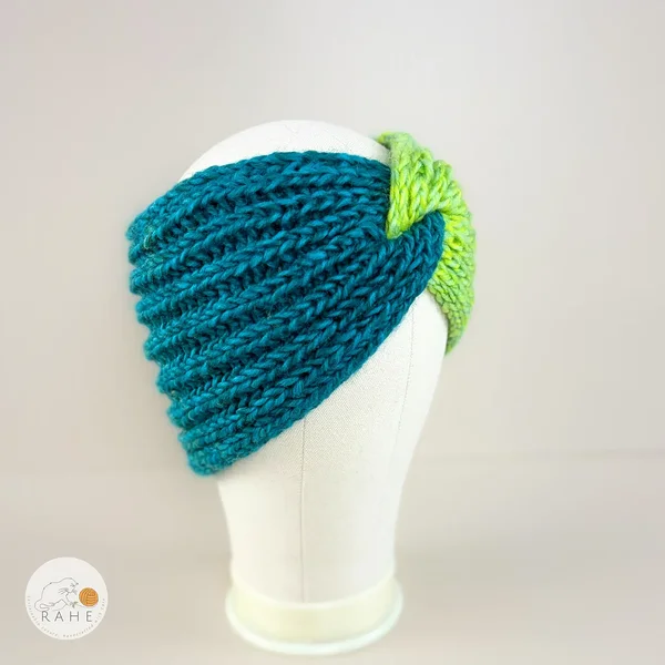 White hand-knitted gradient lime green and teal wool blend headband for girls and women. Angled view