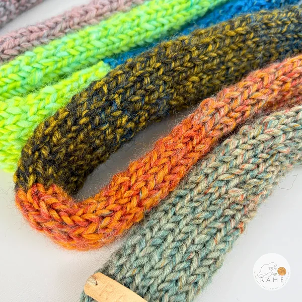 Close view of a narrow and long wool blend colourful gradient scarf