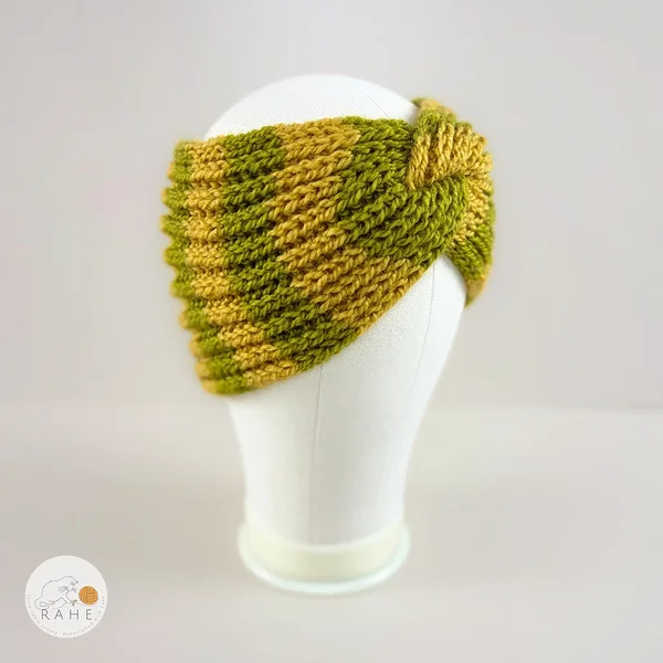 Angled view of a hand-knitted wool blend wide headband with mustard yellow and olive green stripes, RAHEcraft.