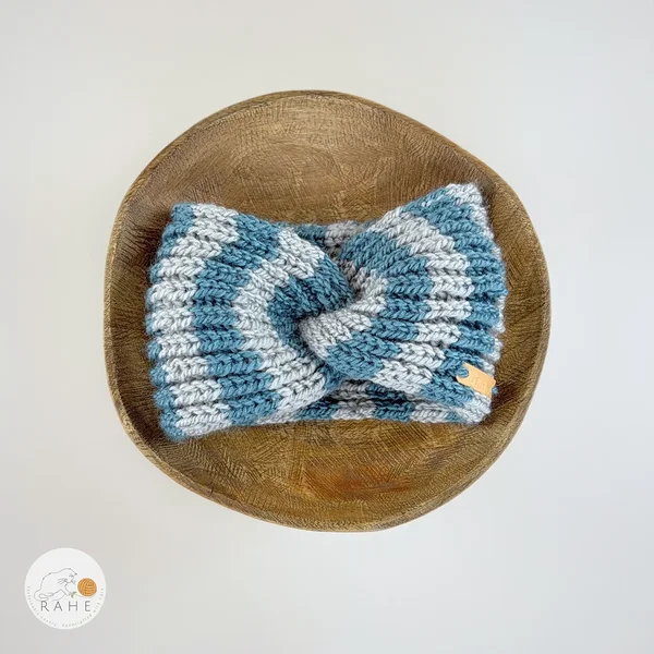 Hand-knitted wide wool blend headband flat lay with twisted center, grey and blue stripes, RAHEcraft