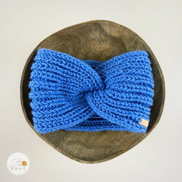 Hand-knitted wide wool blend headband flat lay with twisted center, bright royal blue color, RAHEcraft
