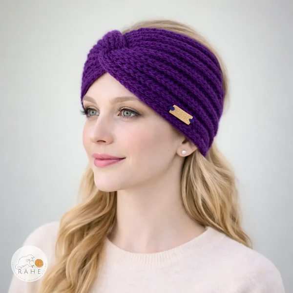 Hand-knitted wide wool blend headband worn by a female model, purple color, twisted design, soft and stretchy knit, RAHEcraft