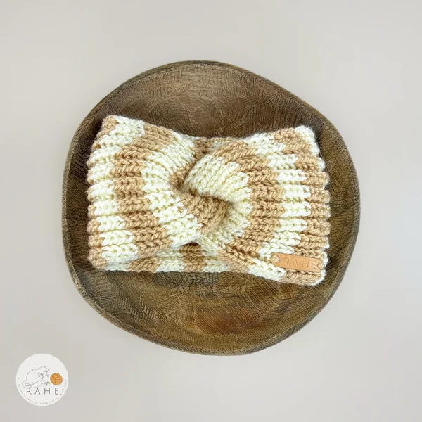 Hand-knitted wide wool blend headband flat lay with twisted center, beige and ivory white stripes, RAHEcraft