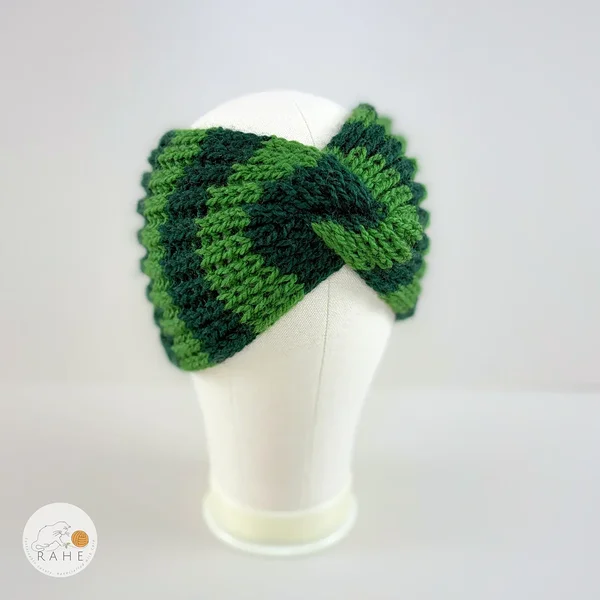 Angled view of a hand-knitted wool blend wide headband with green and dark green stripes, RAHEcraft.