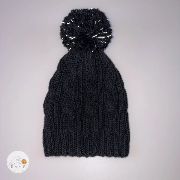 Kids winter beanie with a reflective pom-pom. Hand-knitted merino wool winter hat for boys and girls. Estonian handicraft.