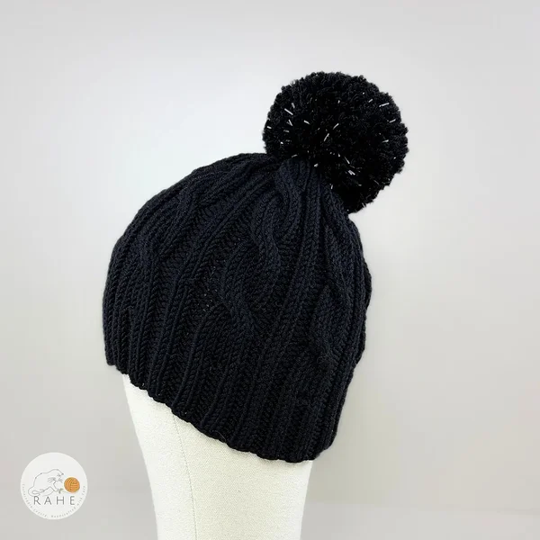 Cozy hand-knitted merino winter beanie for children. Black reflective knitted bobble hat. Handmade in Estonia.