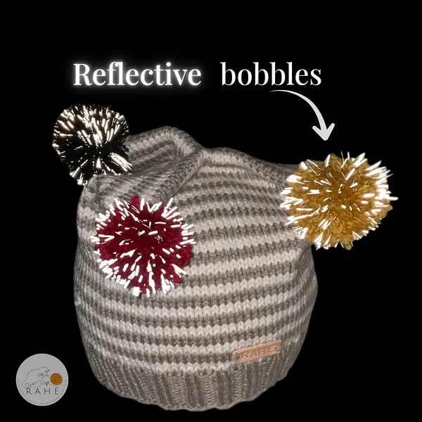 Reflective pom-poms on beige and grey striped kids winter hat – Estonian handmade merino wool beanie by RAHEcraft.