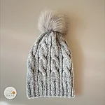 Long light grey cable knit beanie with faux fur pom