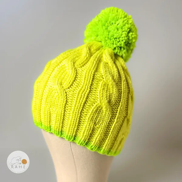 Hand-knitted kids bobble hat. Merino wool winter pom pom beanie for kids. Knitted reflective hat in neon yellow and neon green.  Knitted winter beanie with a reflective bobble. Hand-knitted in Estonia. Winter gift idea.