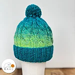 Reflective pom pom wool blend beanie green blue front