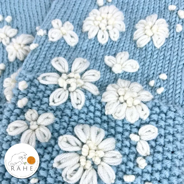Light blue hand-knitted merino wool leg warmers for women and teens – hand-embroidered with white flowers, a luxurious Estonian handmade gift by RAHEcraft.