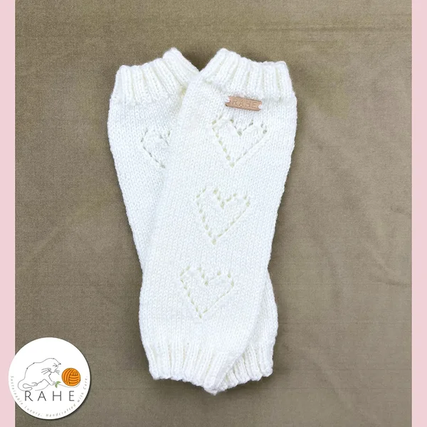 Hand-knitted wool blend white leg warmers with three delicate lace hearts for girls and petite teens. Handicraft gifts from Estonia.