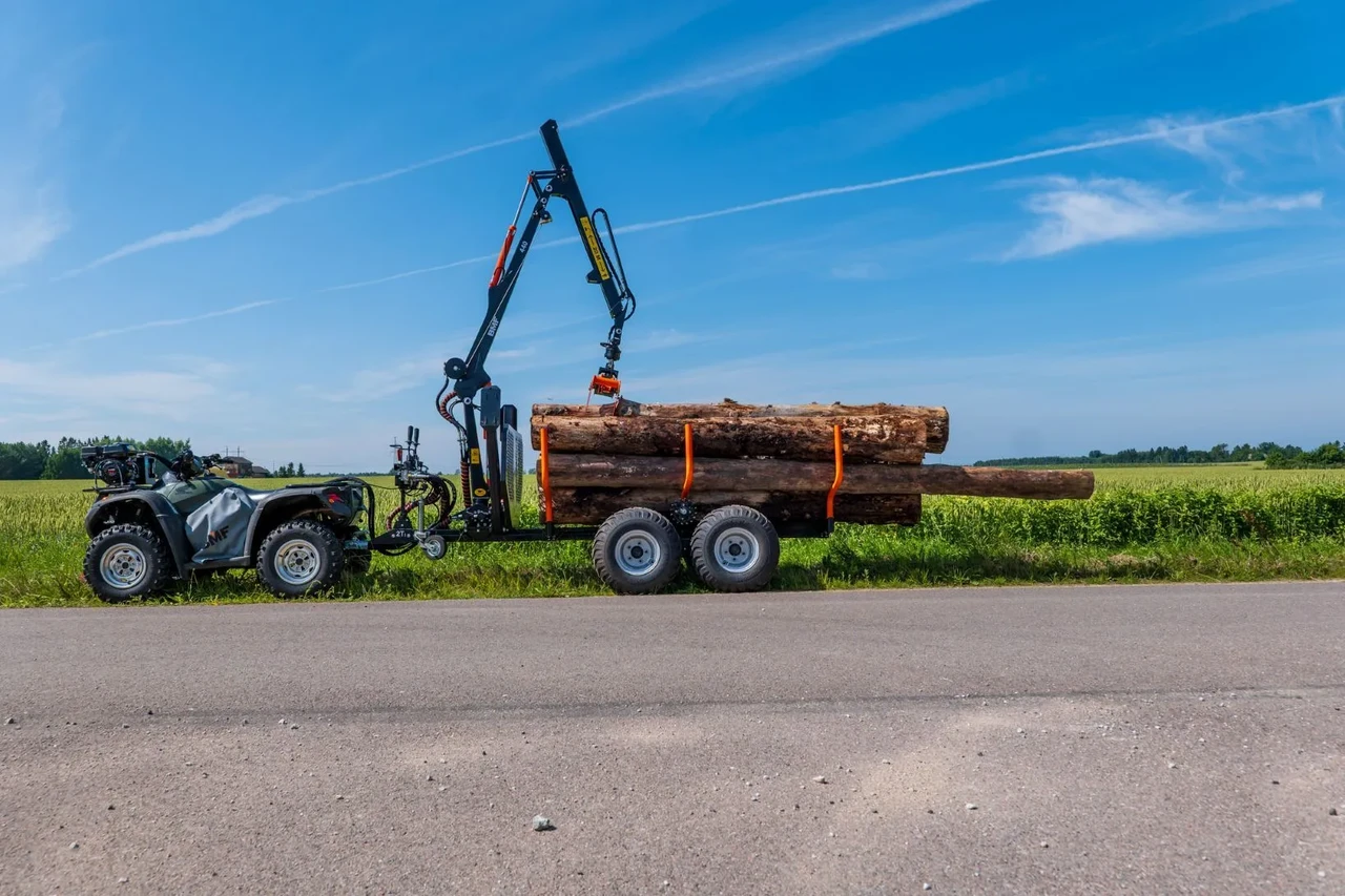 We introduce a new compact ATV trailer and crane set
