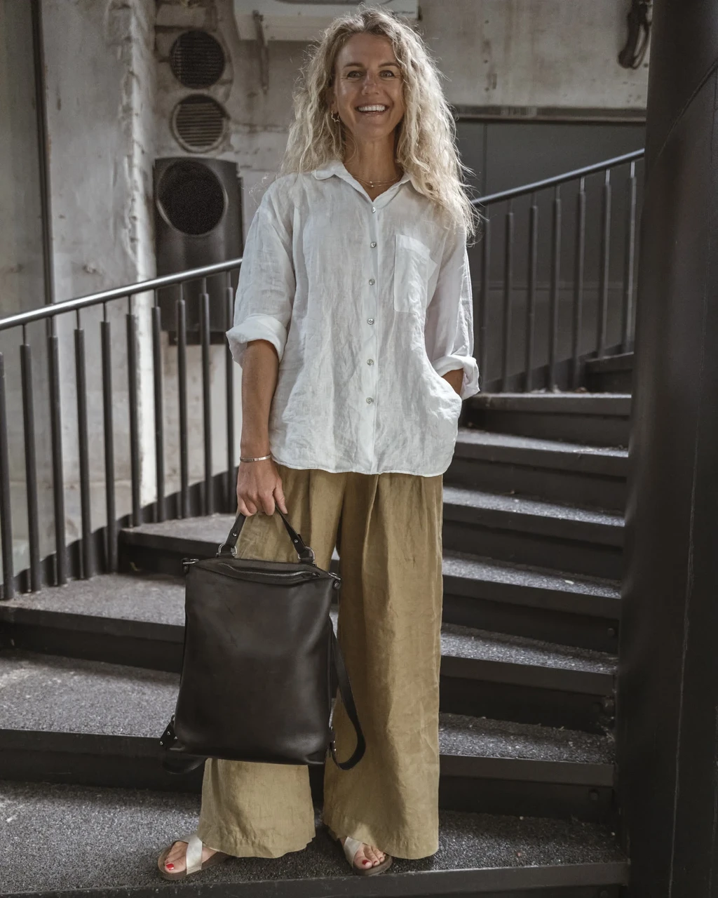 Grete on the stairs with her Mild Librarian