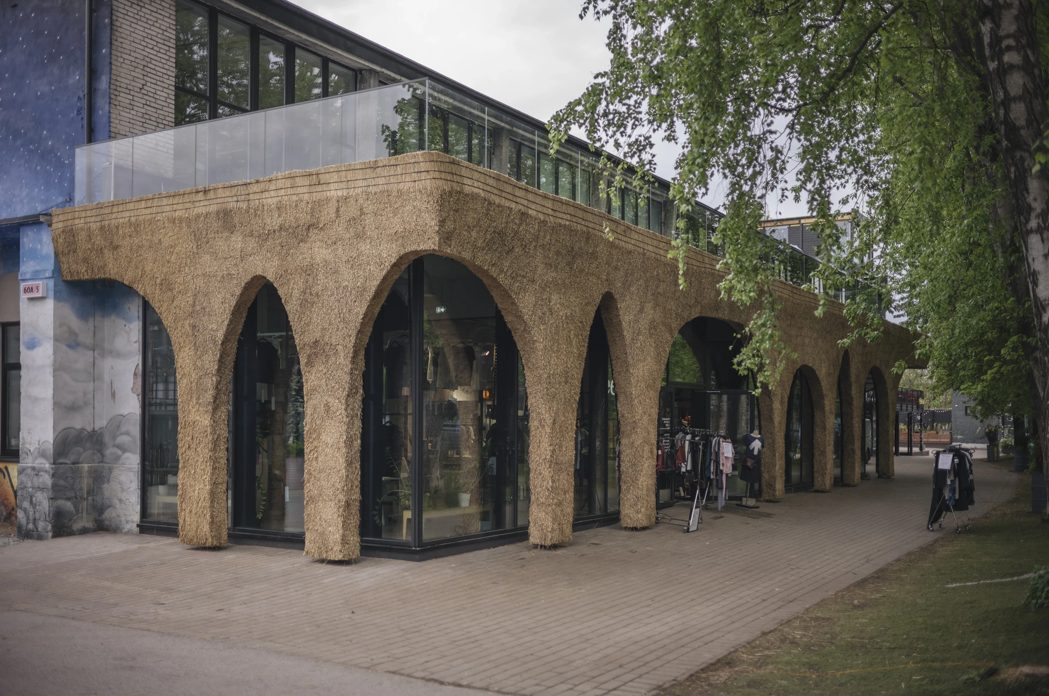 Stella Soomlais's shop in Telliskivi — reed walls in front of the glass façades